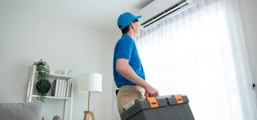 technician service man checking electrical appliance web | River City Heating & Air Conditioning